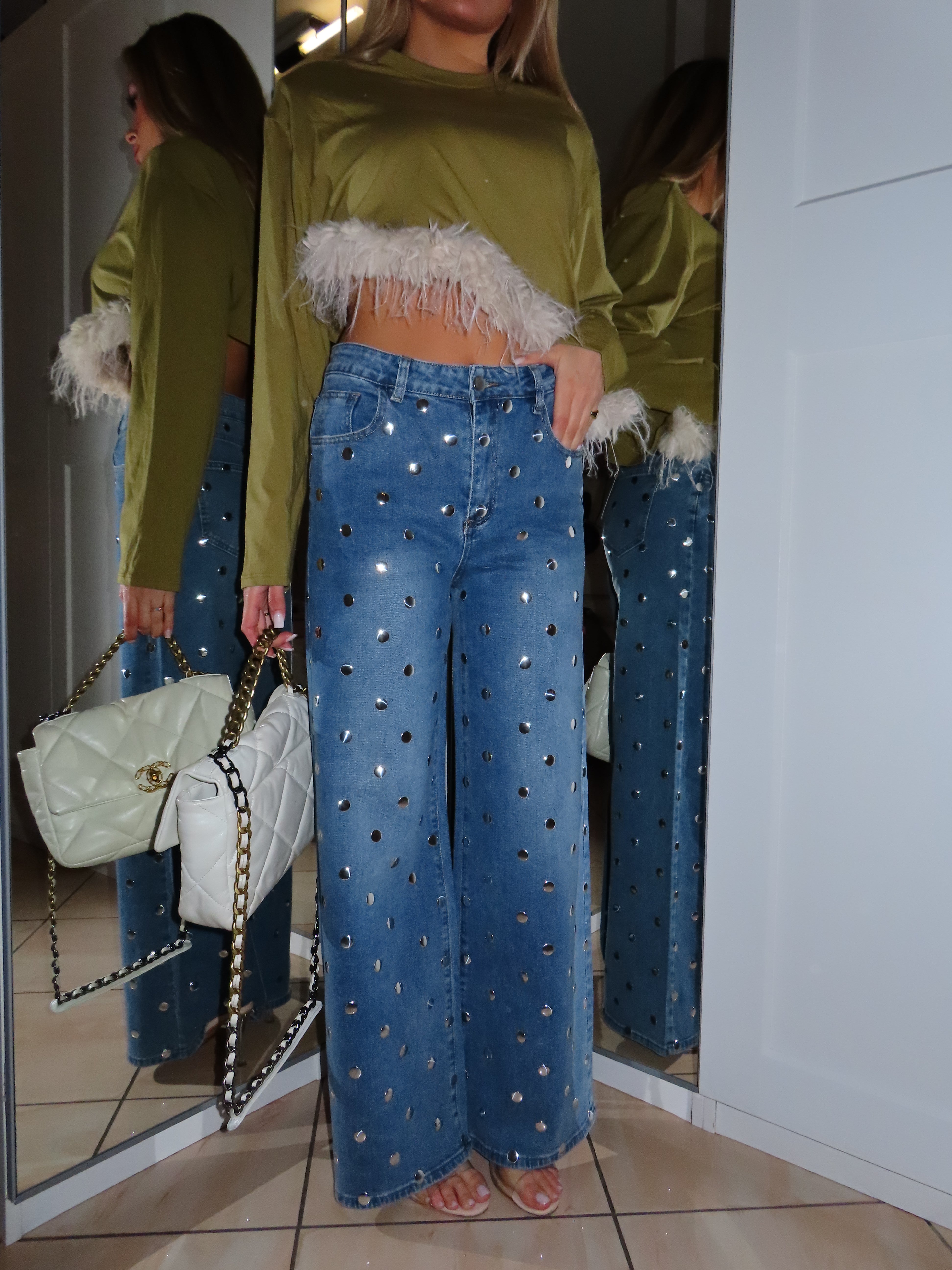 Jeans con borchie sferiche