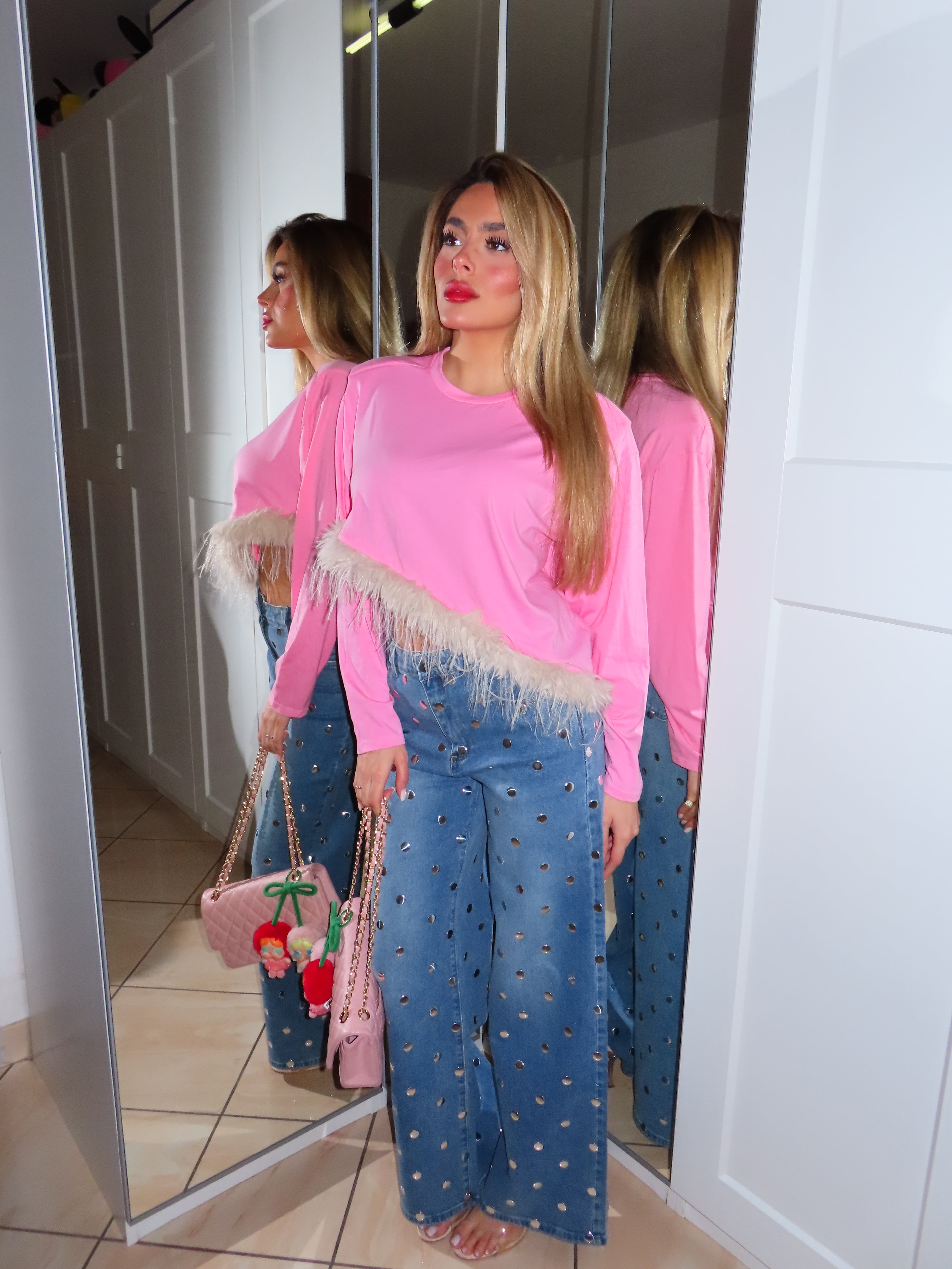 Maglia con piume e spalline