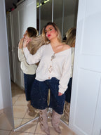 Maglione con spilla gioiello