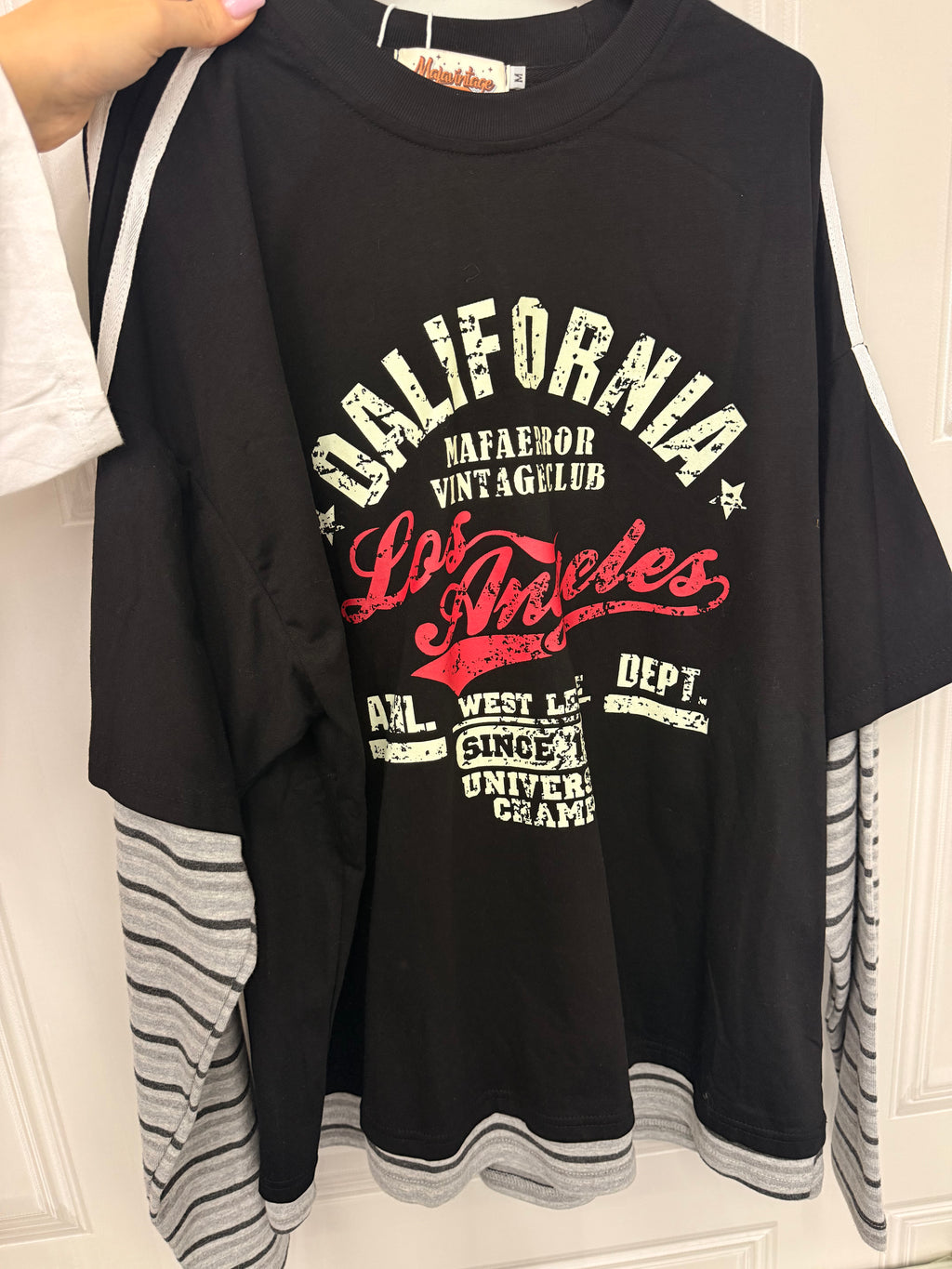 Maglia con maniche a righe