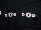 Maglione con spilla gioiello
